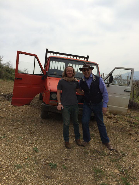 two men in front of truck